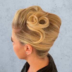 side view blonde and curled twisted updo